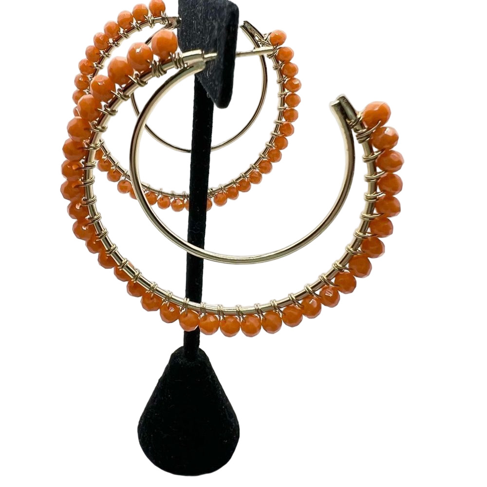 Orange beaded and gold tone double hoop post earrings